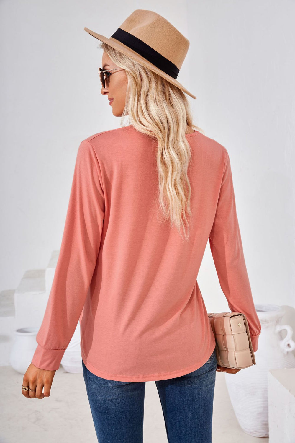 Gathered square neckline jersey top in burnt coral with long sleeves.