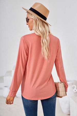 Gathered square neckline jersey top in burnt coral with long sleeves.
