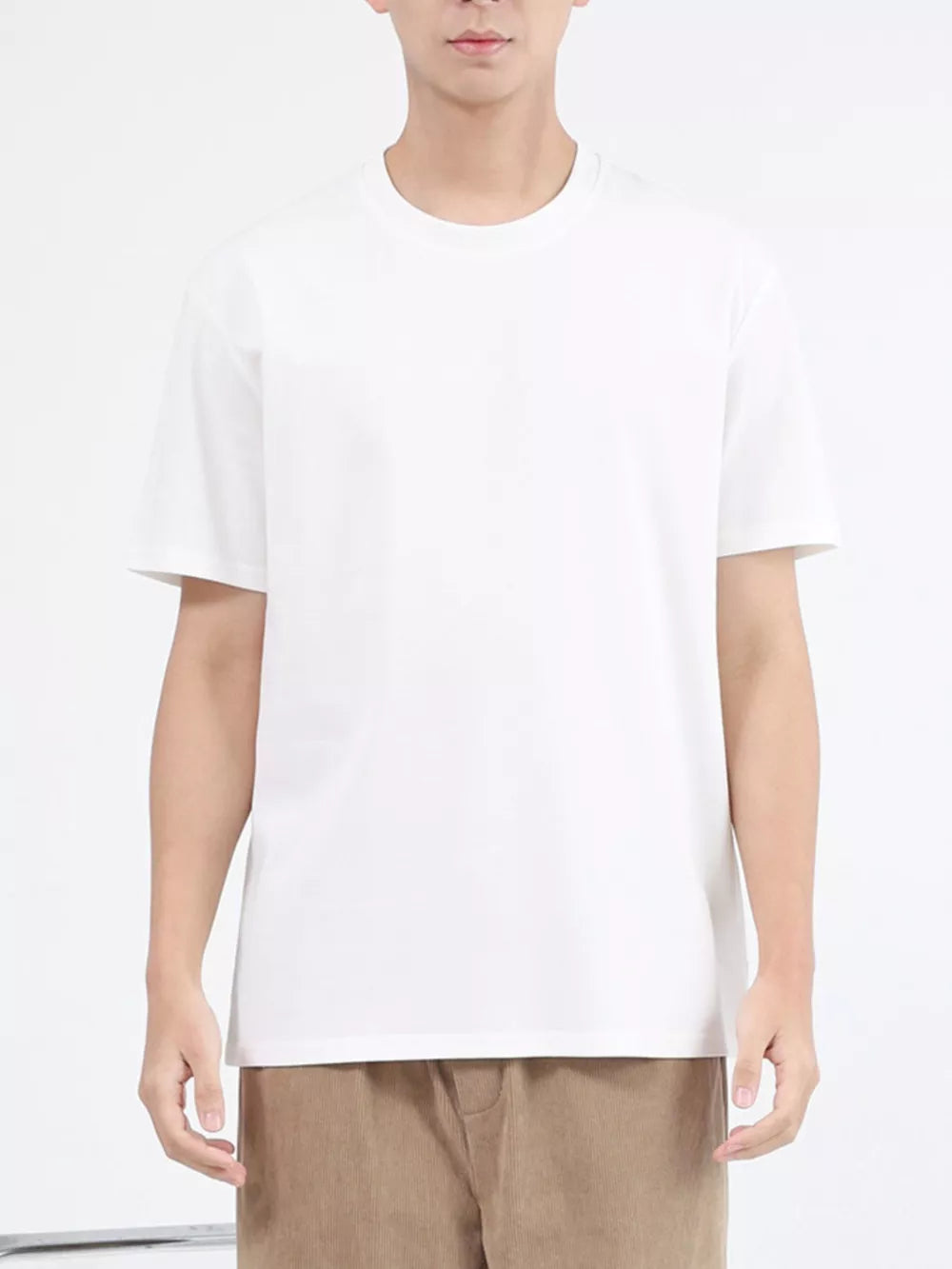 White cotton crew neck t-shirt with short sleeves.