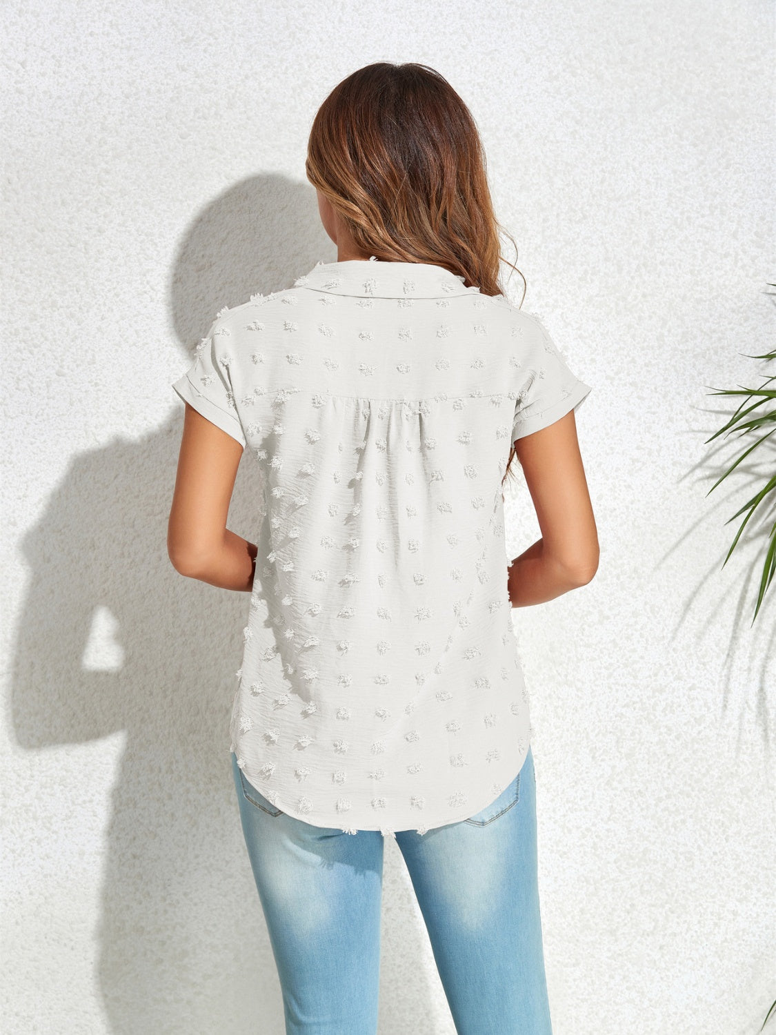 Textured dot poplin shirt in light blue with short sleeves and a collared neckline.
