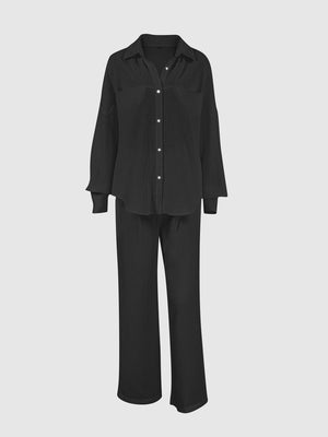 Black textured cotton lounge set with button-up shirt and wide-leg pants.