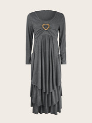 Dark gray tiered midi dress with long sleeves and a heart detail at the neckline.