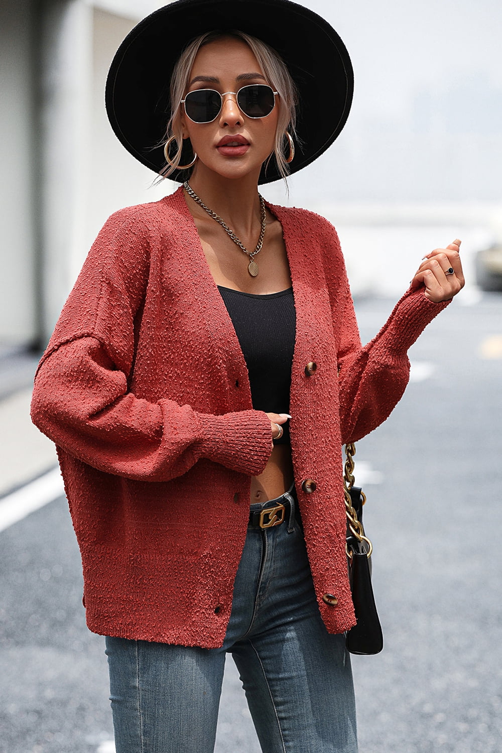 Textured bouclé button-down cardigan in rust with a relaxed fit.