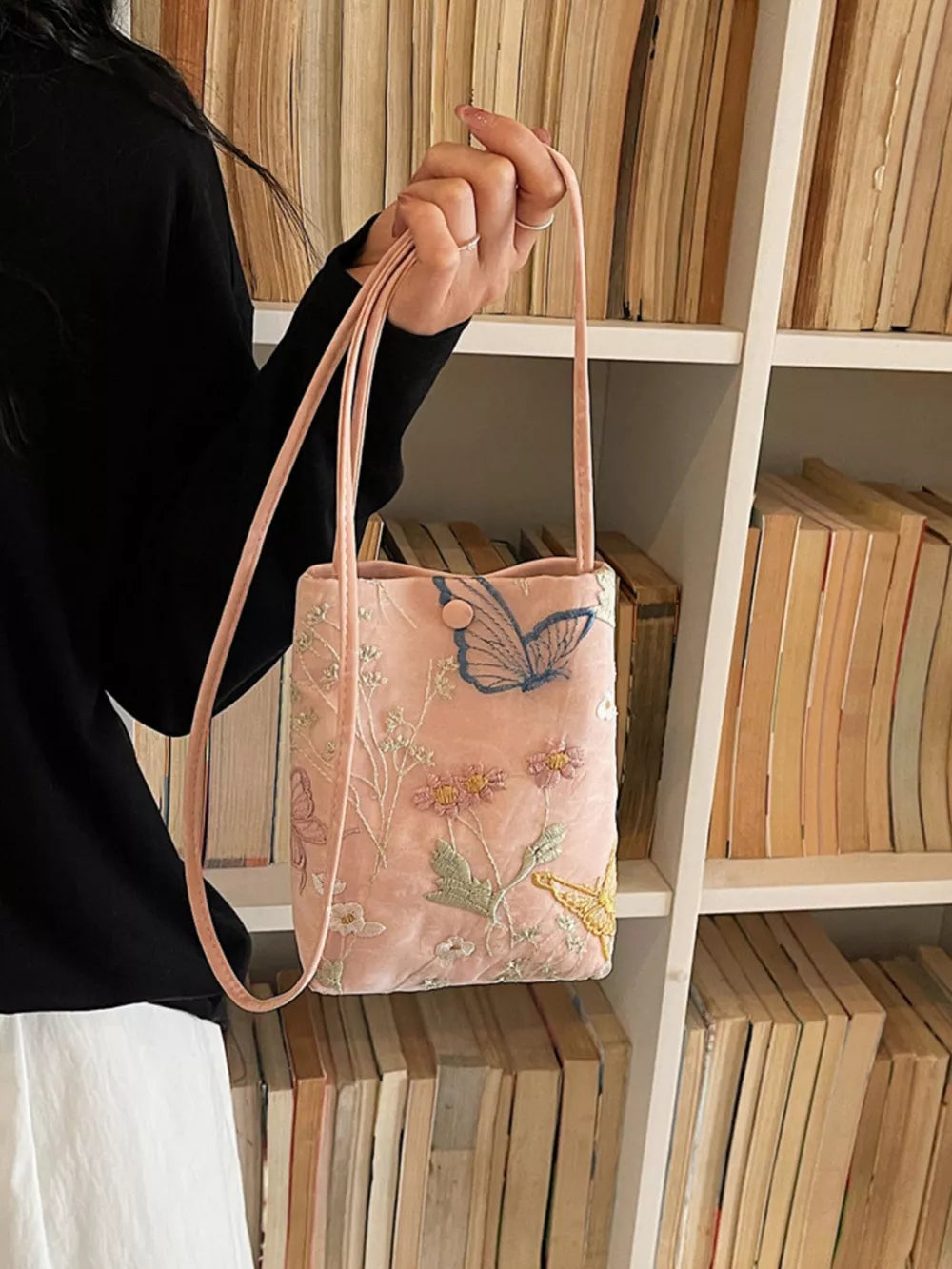 Pink crossbody bag with delicate butterfly and floral embroidery
