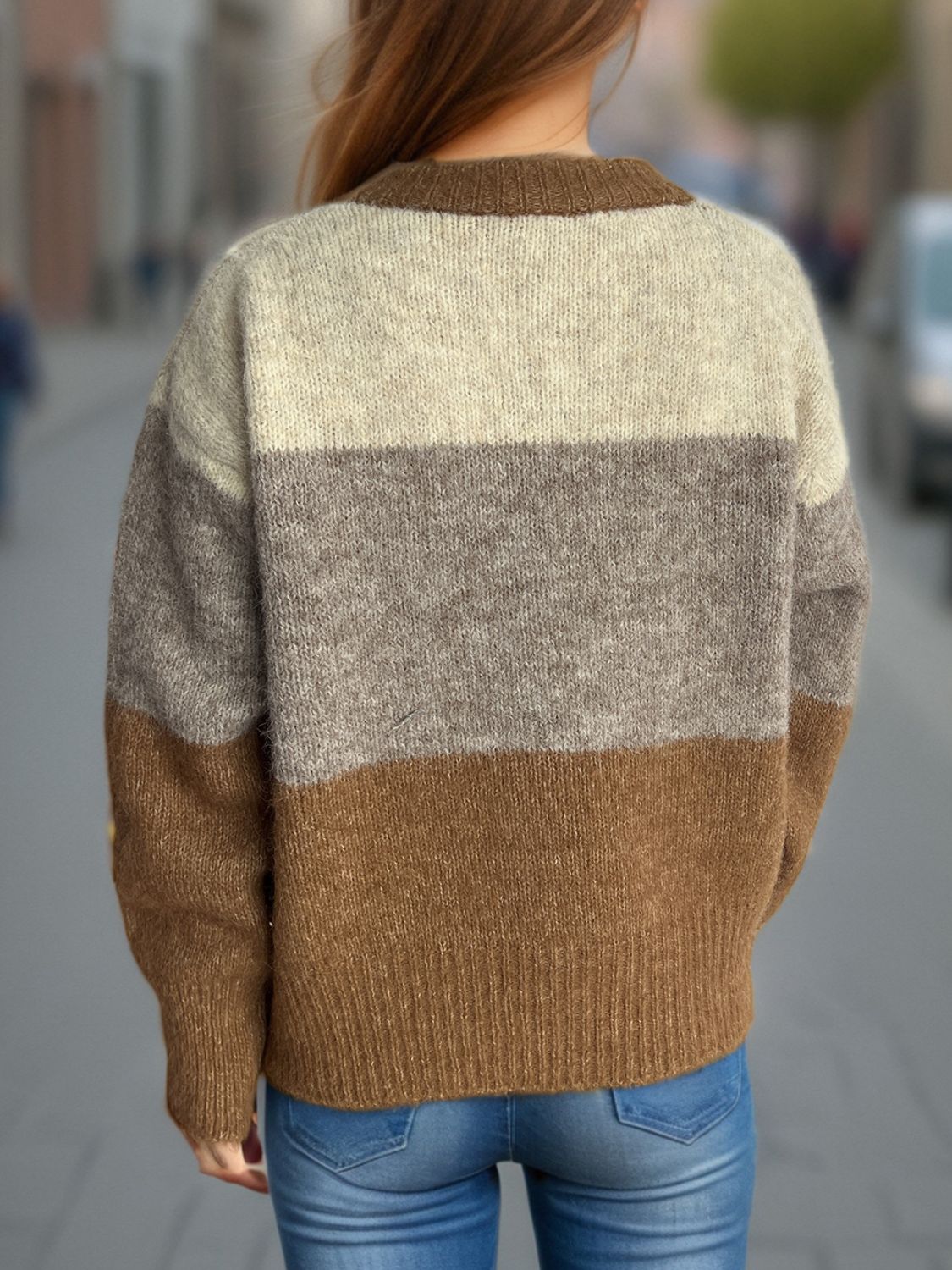Colorblock crewneck button-down knit cardigan in beige, gray, and caramel acrylic.