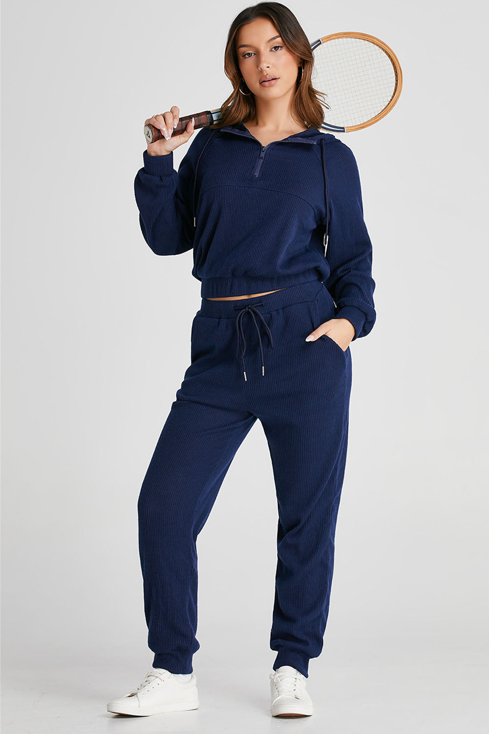 Navy ribbed crop hoodie with quarter zip and matching jogger pants with drawstring waist.