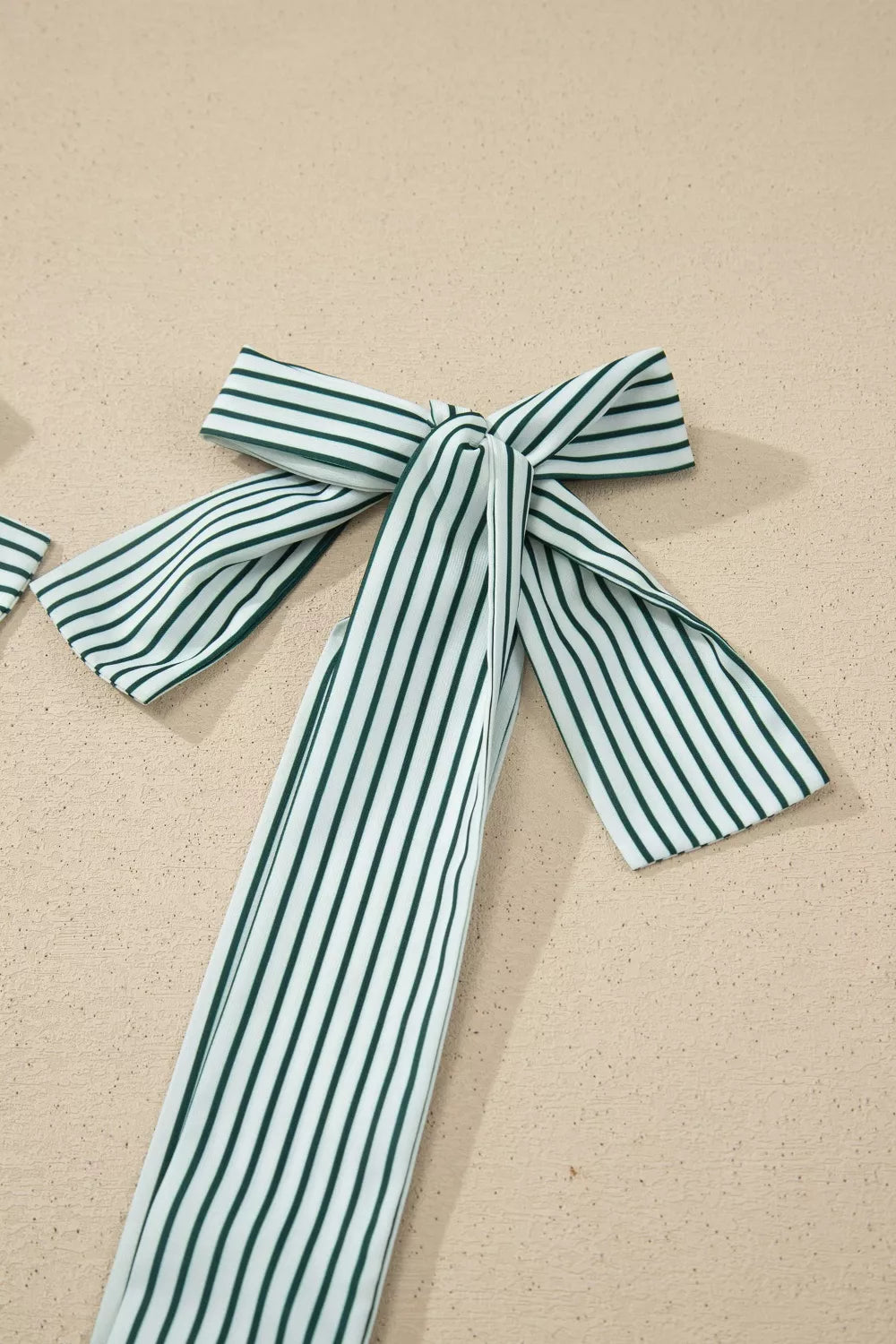 White and green striped cotton tank top with tie straps and square neckline detail.