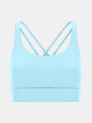 Pastel blue sports bra with crisscross back straps and a scoop neckline.