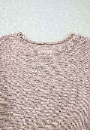 Beige knit sweater with a crew neck and visible panel sleeve detail.
