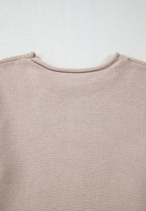 Beige knit sweater with a crew neck and visible panel sleeve detail.
