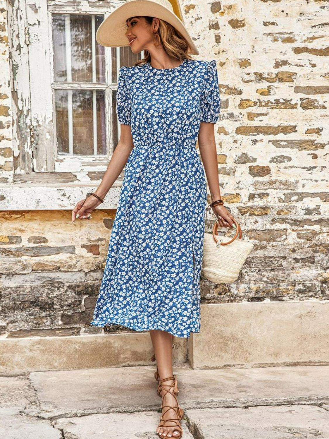 Blue floral puff sleeve midi dress with a slit, cinched waist, and round neckline.