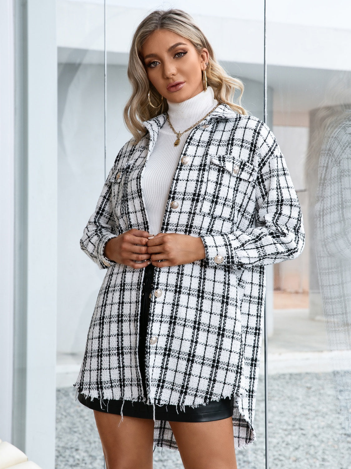 Textured plaid shacket in white with raw hem and buttoned front.