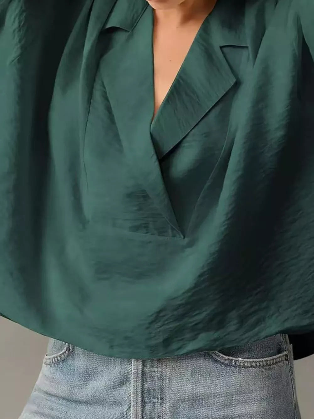 Dark green V-neck half sleeve shirt with a relaxed fit and textured fabric.