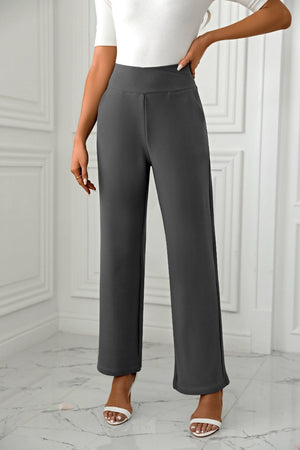Dark gray wide-leg trousers with a sculpted waist and a relaxed fit.