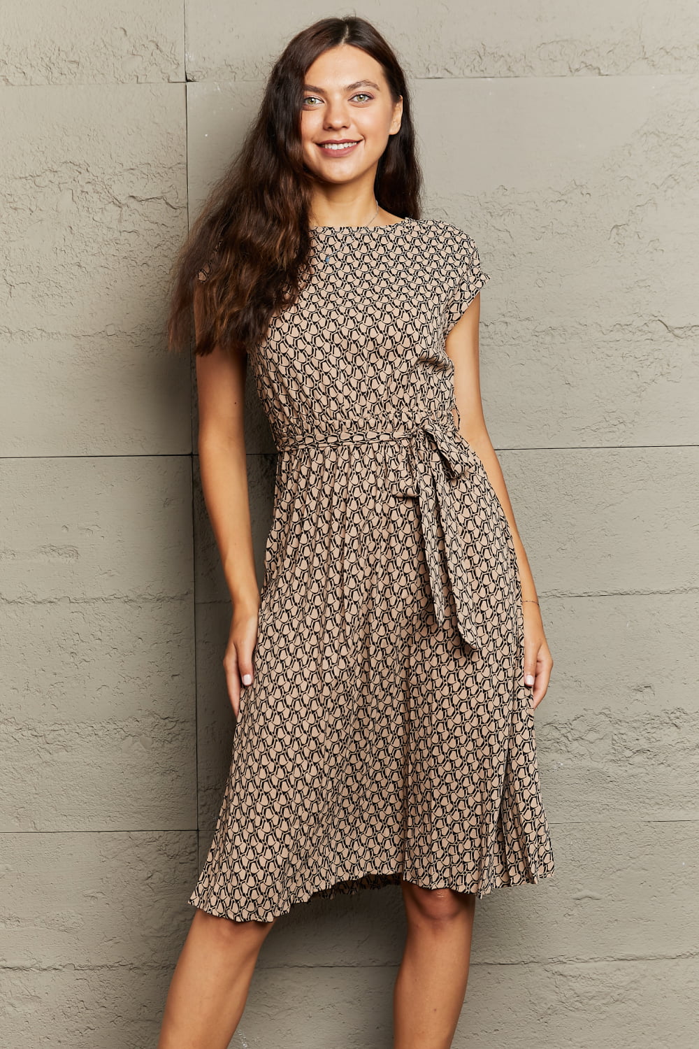Geometric print midi dress in camel with short sleeves and a tie waist.