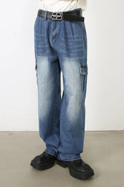 Faded denim cargo pants in medium wash with multiple pockets and a relaxed fit.