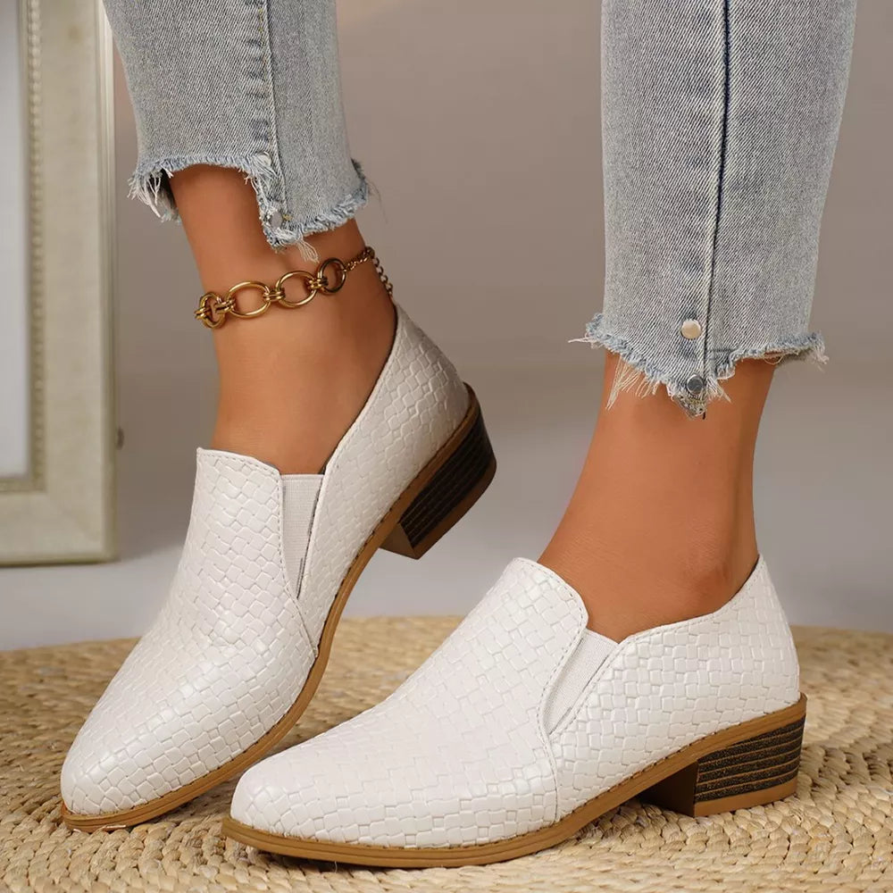 White woven texture pointed loafers with block heels and elastic side panels.