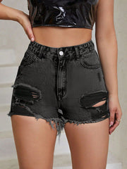 Distressed black denim shorts with frayed hem and ripped details.