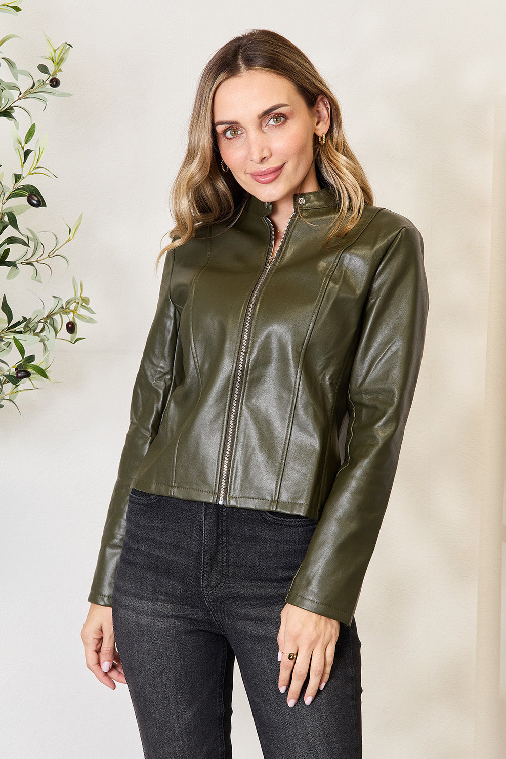 Army green faux leather biker jacket with zip front and stand collar.