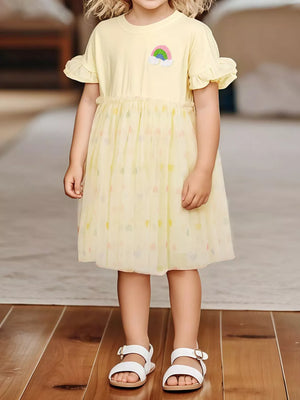 Yellow baby dress with rainbow applique, ruffled sleeves, and tulle skirt with heart pattern.