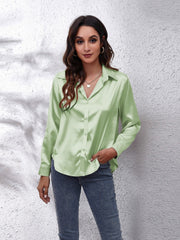 Light green satin collared button-down shirt with long sleeves.