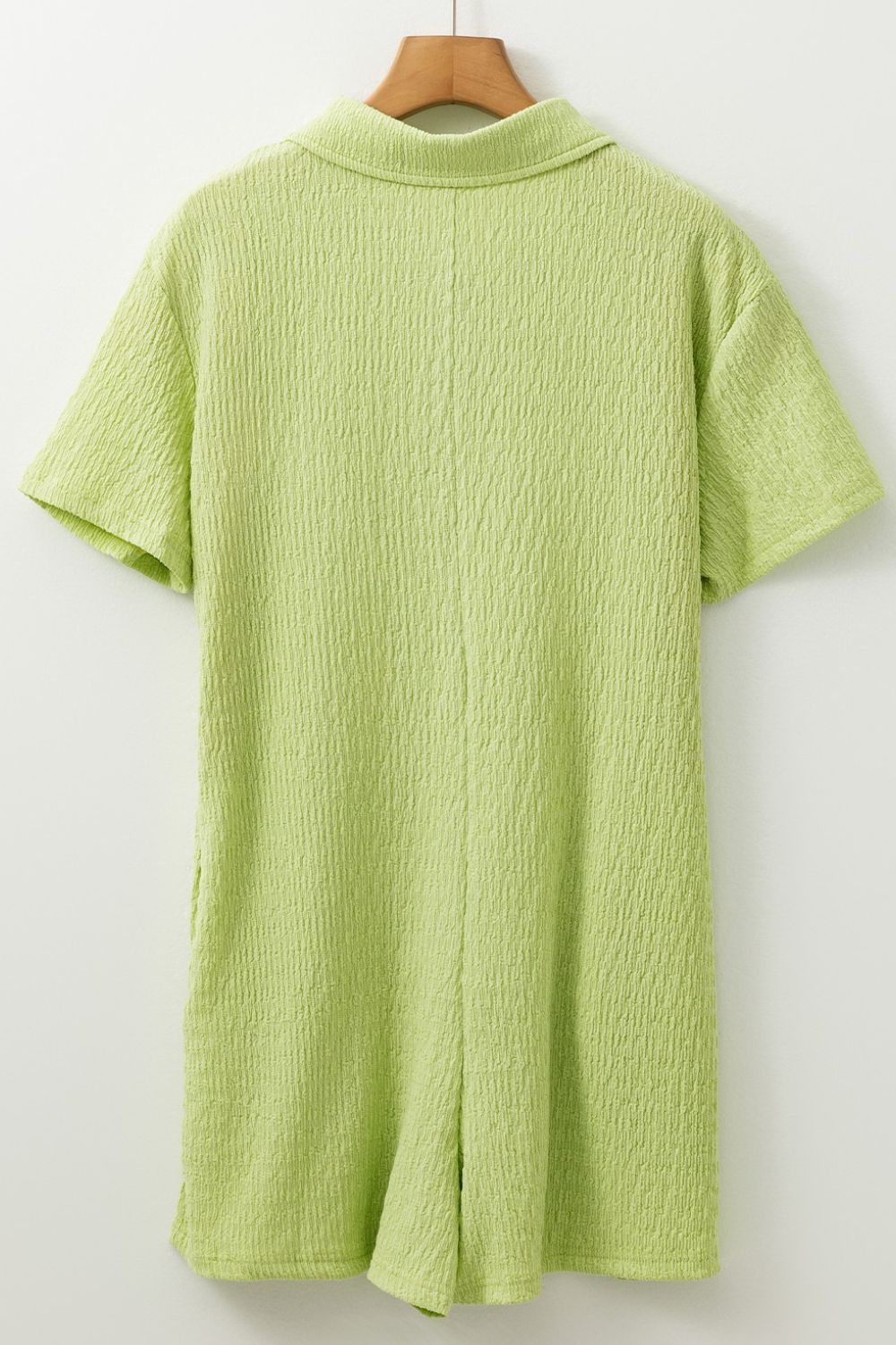 Lime textured collared romper with short sleeves and patch pocket detail