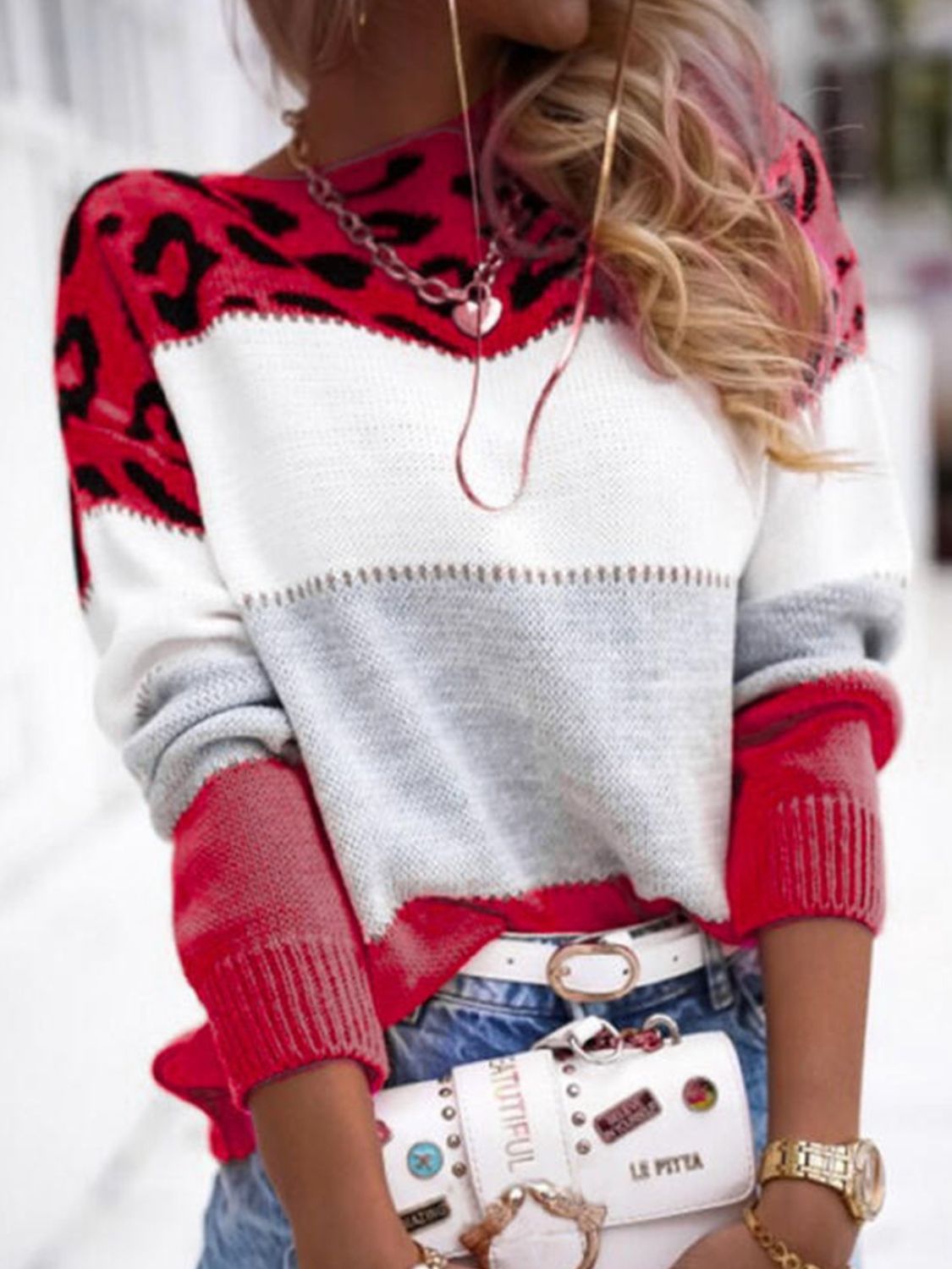 Leopard panel knit sweater in scarlet, white, and gray colorblock with red sleeves.