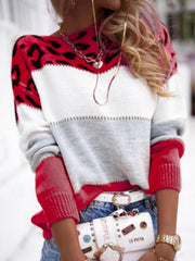 Leopard panel knit sweater in scarlet, white, and gray colorblock with red sleeves.