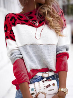 Leopard panel knit sweater in scarlet, white, and gray colorblock with red sleeves.
