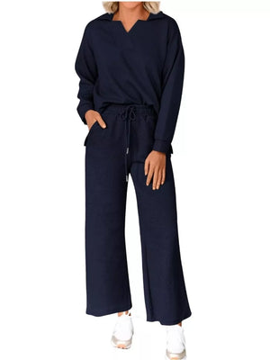 Navy blue V-neck textured lounge set with drawstring pants and long sleeves.