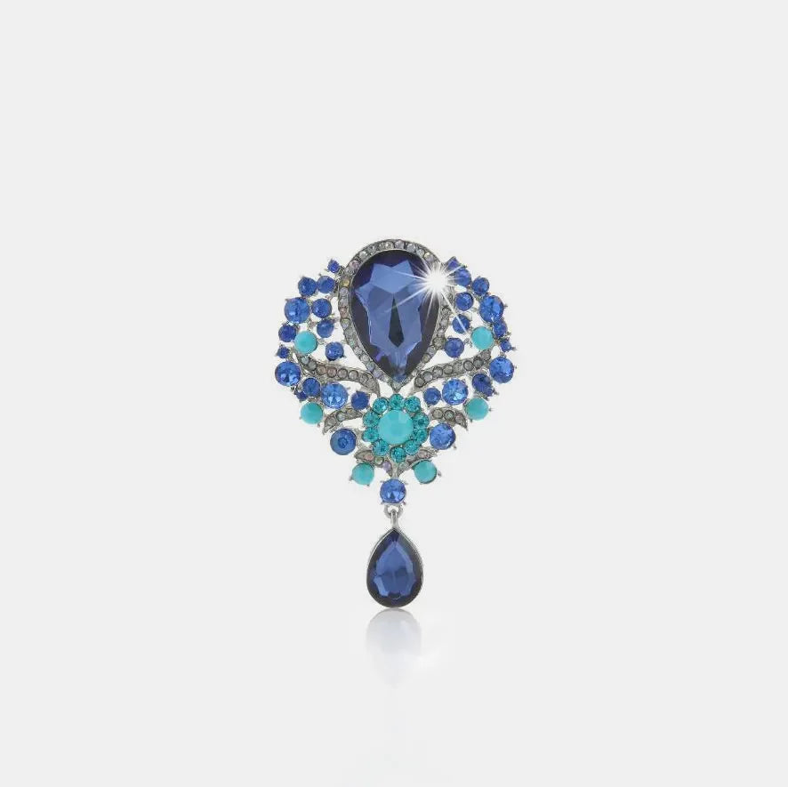 Blue teardrop embellished brooch with alloy setting and crystal accents