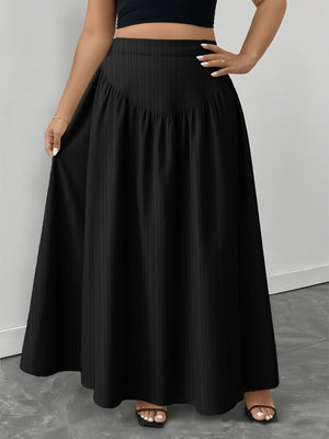 Black a-line maxi skirt with subtle vertical ribbing and a gathered waistband.