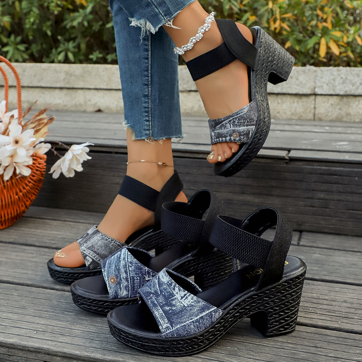 Denim-patterned high block heel sandals in blue and black with elastic straps.