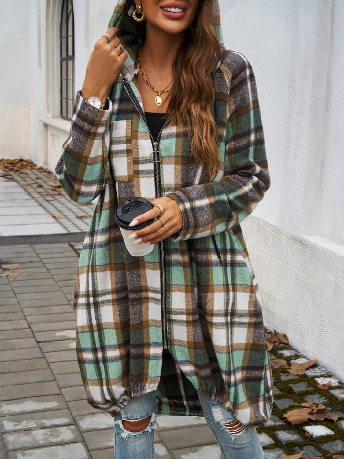 Draped plaid cocoon hoodie jacket with zipper and ring pull, in green, brown, and white.