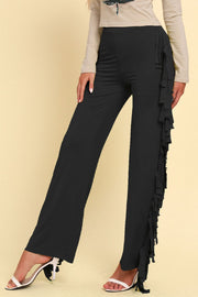 Black palazzo trousers with cascading fringe detail on the side.