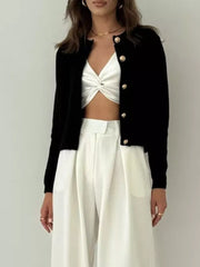 Black textured knit cardigan with gold button detail and crew neck.