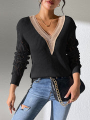 Black knit sweater with lace-trimmed V-neck and openwork sleeves
