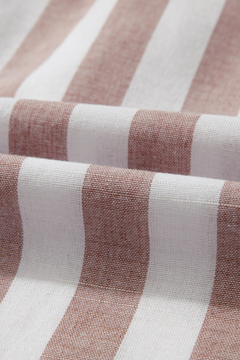 Gathered collar stripe sleeveless blouse in stripe pattern.