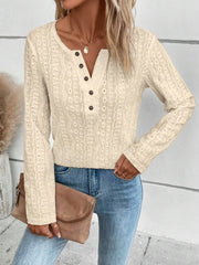 Cream textured henley long sleeve top with button detail and open knit pattern.