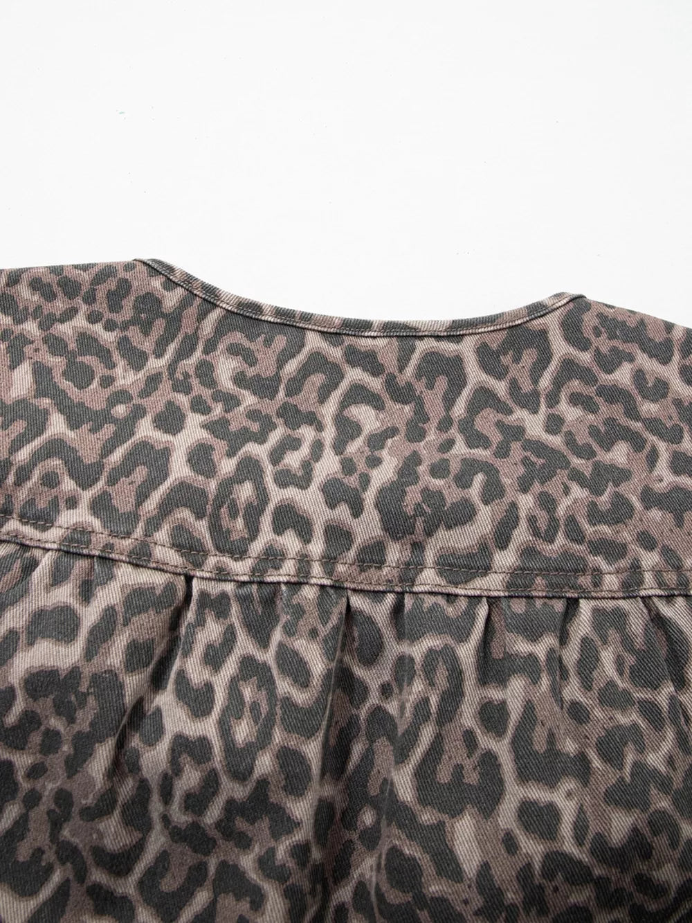 Leopard print denim V-neck top with pleat detail at yoke