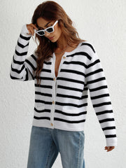 White and black horizontal stripe knit cardigan with pockets and button front.