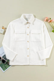 White textured corduroy overshirt with patch pockets and button front.