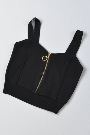 Black ribbed knit crop top with exposed gold zipper and ring pull.