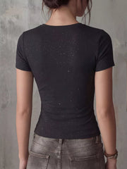 Black fitted t-shirt with short sleeves and a subtle sparkle detail.