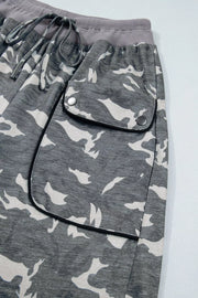 Camouflage barrel pants with cargo pockets and drawstring waist.