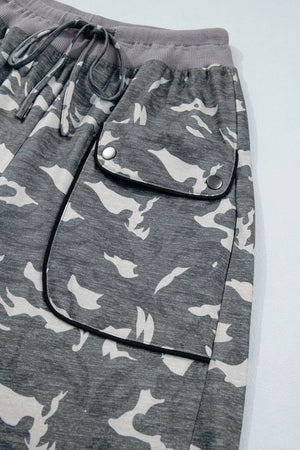 Camouflage barrel pants with cargo pockets and drawstring waist.