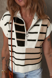Colorblock ribbed zip polo with short sleeves and a quarter-zip neckline.