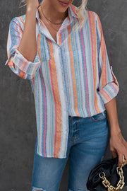 Coastal Stripe Button-Down Blouse in orange and blue stripes with rolled sleeves.