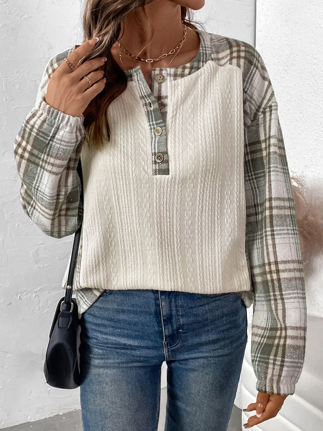 Textured raglan henley top in cream with plaid sleeves and button detail