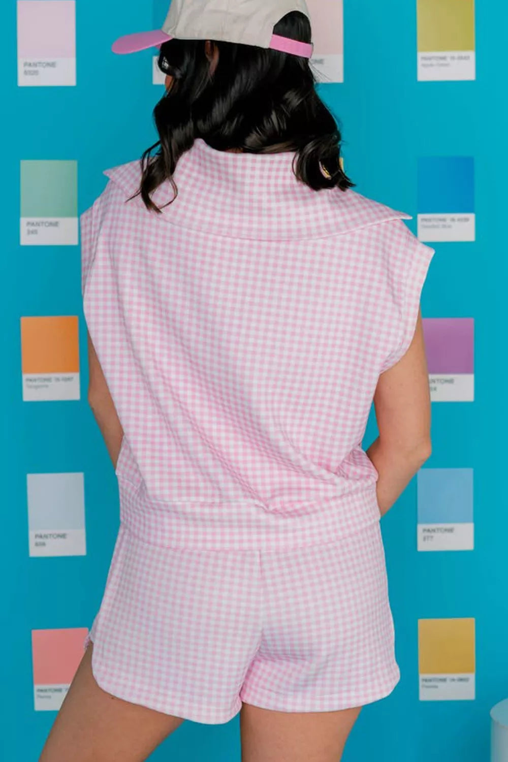 Pink gingham two-piece set with collared zip-detail top and drawstring shorts.